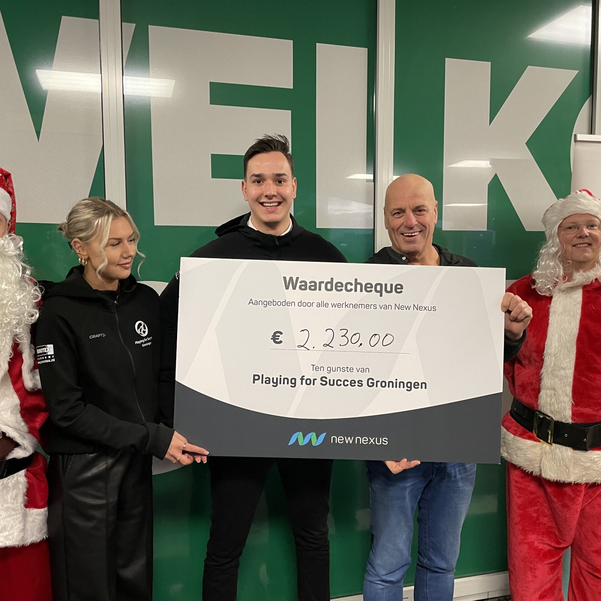 Playing for success met cheque van New Nexus